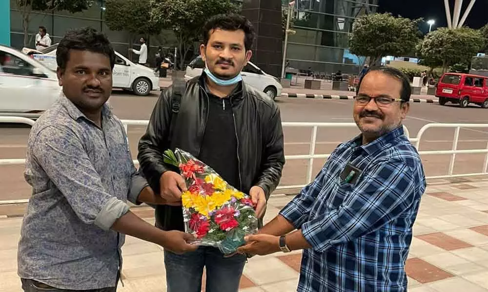 Tej Kumar from Rolla mandal in Anantapur district being received at Benguluru airport by revenue officials on Thursday