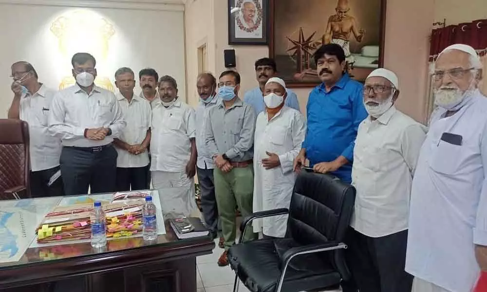Gudur legislator Dr V Varaprasad Rao handing over a representation to the Collector K V N Chakradhar Babu in Nellore on Thursday along with JAC leaders