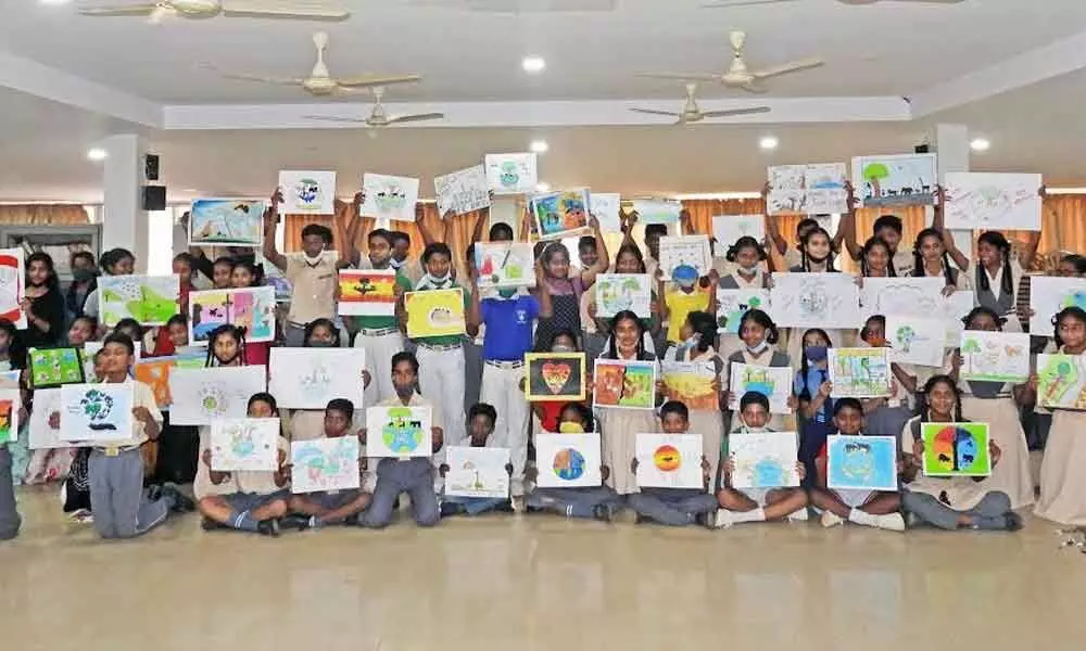 Participants showcasing their drawings at IGZP in Visakhapatnam on Thursday