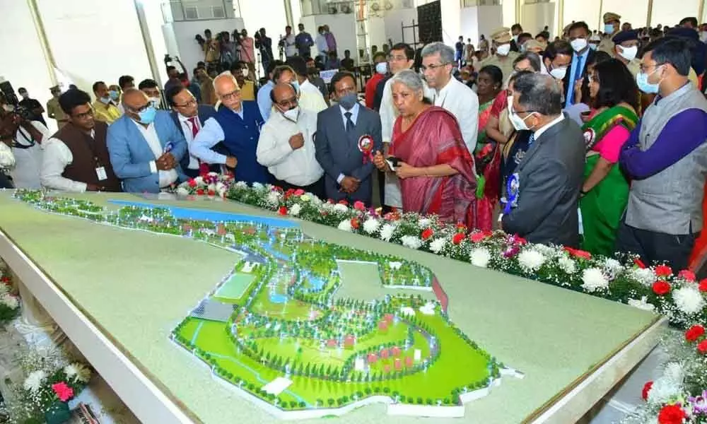 Union Finance Minister Nirmala Sitharaman, State Finance Minister Buggana Rajendranath Reddy and MP Gorantla Madhav having a glimpse at the map of the Customs Academy complex during the foundation-laying ceremony  at Palasamudram village in Anantapur district on Saturday