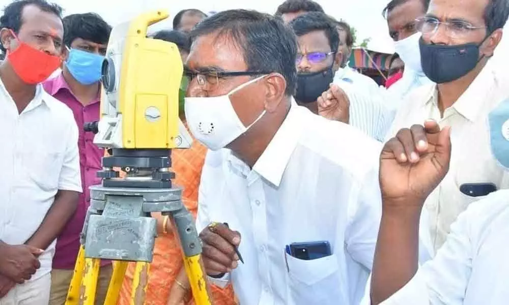 Agriculture Minister Singireddy Niranjan Reddy inspecting the survey equipment during the Survey of Karne Thanda Lift Irrigation project which  will be opened by the cm on  march 8