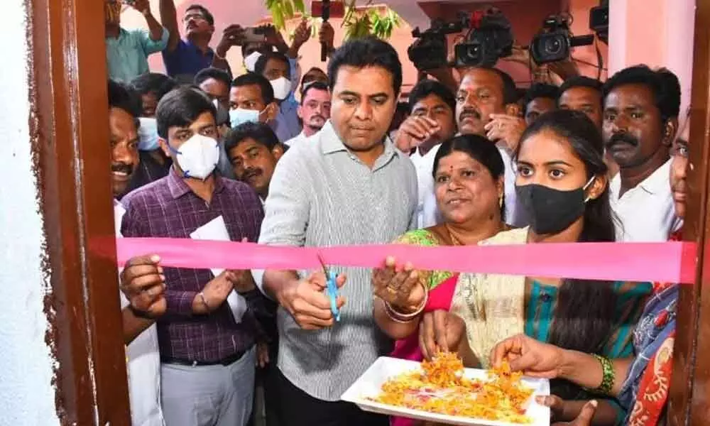 Minister KT Rama Rao inaugurating double-bedroom houses at Venkatapur village suburb of Ellareddypeta mandal in Sircilla district on Saturday.