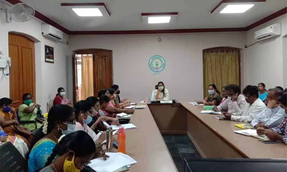 Sub-collector Chahat Bajpai along with ICDS Project Director Praveena addressing a division-level meeting on prohibition of child marriages, at her chamber in Nandyal on Saturday.