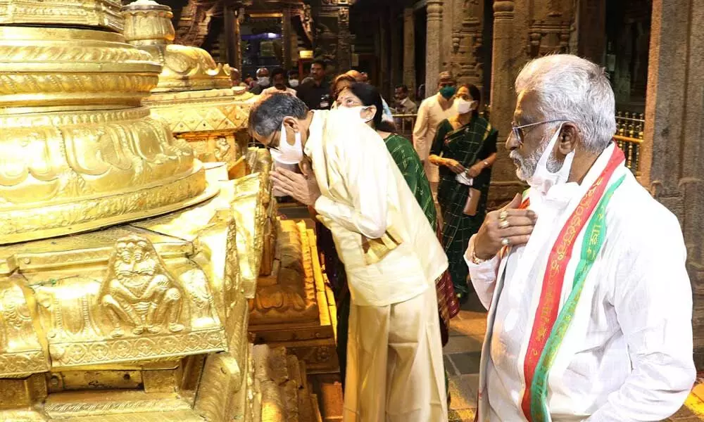 Chief Justice of India Justice N V Ramana offering prayers at Dhwaja Sthambham at Tirumala on Sunday. TTD Chairman Y V Subba Reddy is also seen.