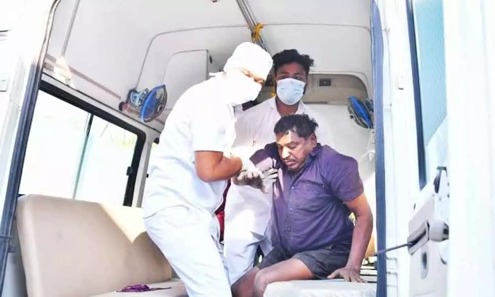 Medical team personnel shifting an injured worker to hospital at Ramagundam in Peddapalli district on Monday