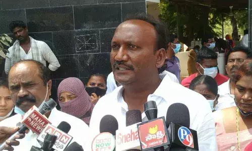 Former MLA Amanchi Krishna Mohan addressing the media after meeting SP Malika Garg in Ongole on Monday