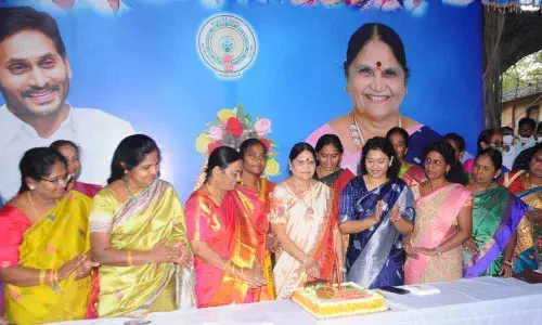 ZP Chairperson B Venkayamma cutting a cake as part of International Womens Day celebrations at her office in Ongole on Monday