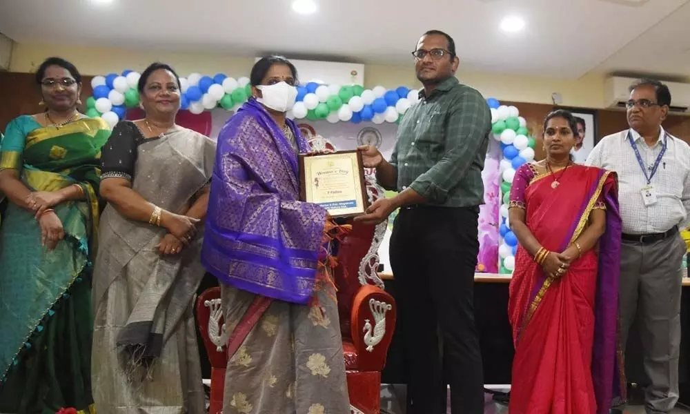 In-Charge Collector Harendhira Prasad felicitating women officers in Nellore on Tuesday