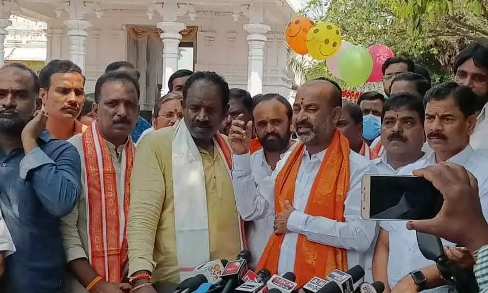 State BJP chief Bandi Sanjay Kumar addressing the media at Anjaneya Swamy Temple in Karmanghat on Tuesday