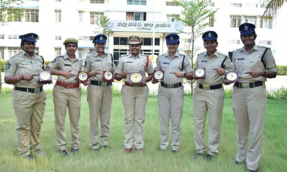Women constables showing their merit awards at district police office in Machilipatnam on Tuesday