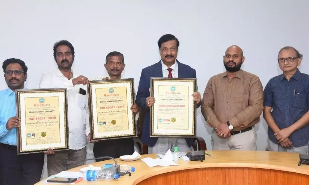 AKNU Vice-Chancellor M Jaganatha Rao and others showing the ISO certification on the university campus in Rajamahendravaram on  Tuesday
