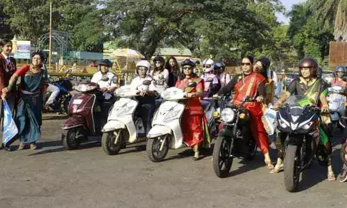 Mysuru Inner Wheel club members are seen riding motorcycles on major city roads on Tuesday on the occasion of the International Women’s Day