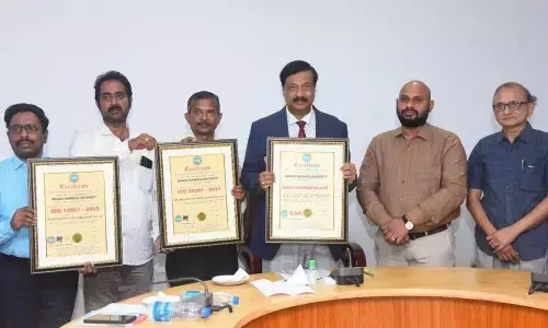 AKNU Vice-Chancellor M Jaganatha Rao and others showing the ISO certification on the university campus in Rajamahendravaram on  Tuesday