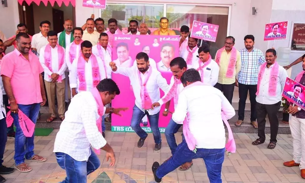 Youth celebrating after the CM KCR’s announcement on Job notifications, at the district party office in Khammam on Wednesday