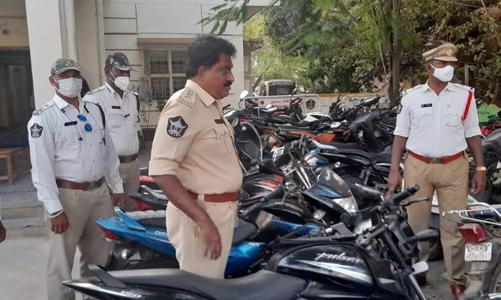 Traffic DSP P Mallikarjuna Rao checking the seized vehicles at traffic police station in Ongole on Wednesday