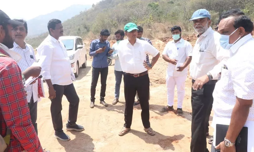 Municipal Commissioner P S Girisha along with Municipal, Revenue and Housing officials at Kothapalli Jagananna Colony near Chandragiri on Wednesday