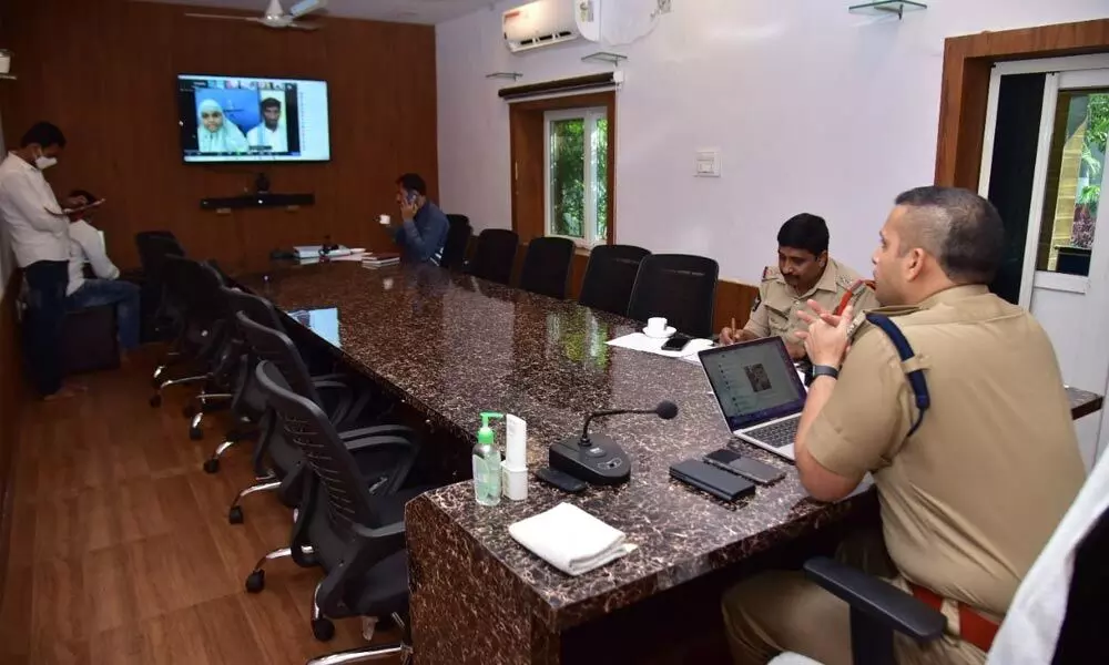 SP Siddharth Kaushal listening to the problems of people through a video conference ‘Pratyaksha Spandana’ from his office in Machilipatnam on Wednesday