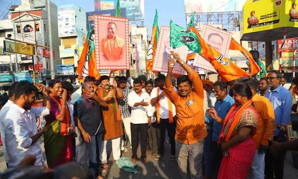BJP activists celebrate partys landslide in Assembly polls