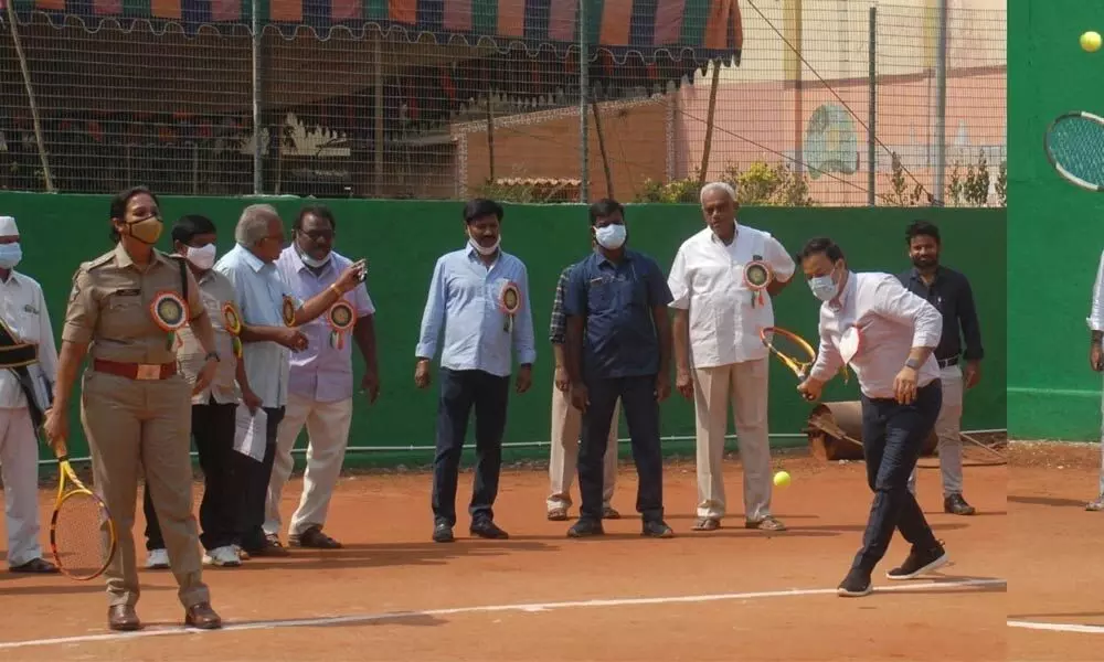 Prakasam District Collector Pravin Kumar and SP Malika Garg playing tennis opposite Ongole MP Magunta Srinivasulu Reddy at State-level open tennis tournament in Ongole on Friday