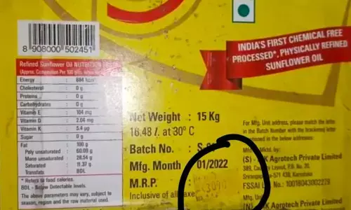 MRP of an oil can being tampered at a dealers godown