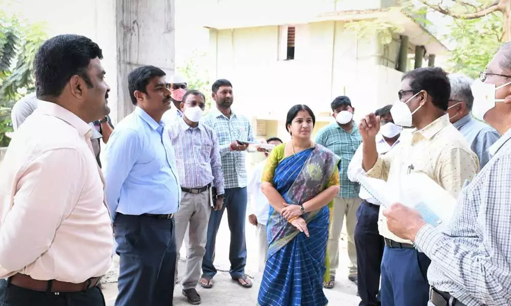 Krishna District Collector J Nivas with Mayor R Bhagyalakshmi and VMC Commissioner Ranjit Basha at the VMC office in Vijayawada