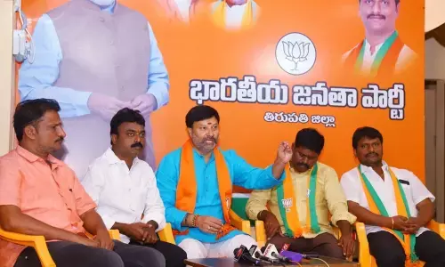 BJP state spokespersons Bhanuprakash Reddy and Samanchi Srinivas addressing media at party office in Tirupati on Saturday