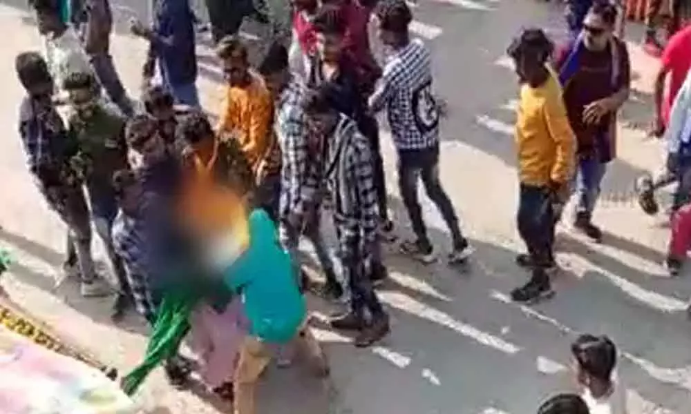 Several men are seen forcing themselves on a woman during Madhya Pradesh festival