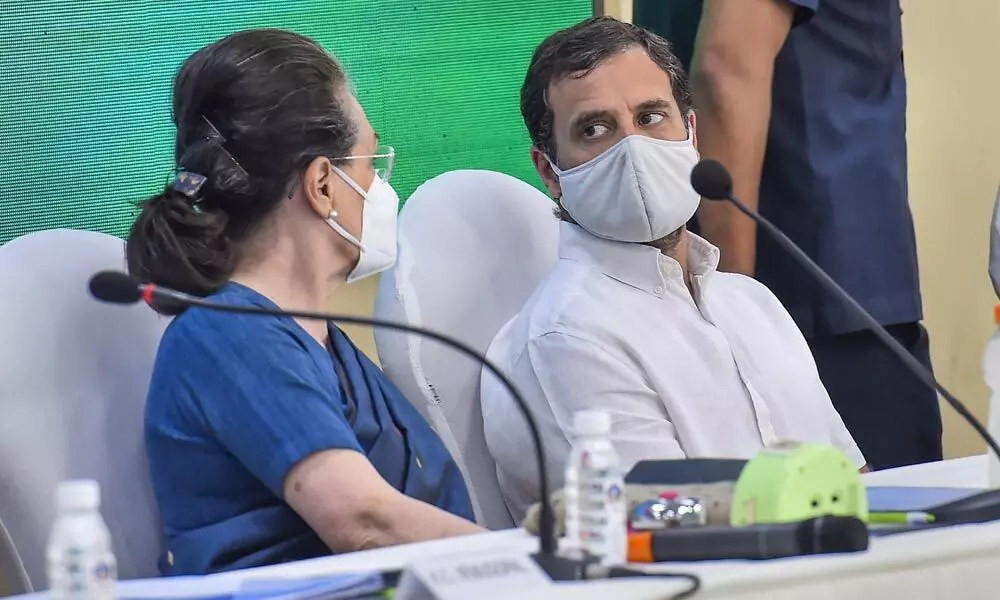 Congress interim president Sonia Gandhi chairs the Congress Working Committee meeting, in New Delhi on Sunday. Congress leader Rahul Gandhi is also seen