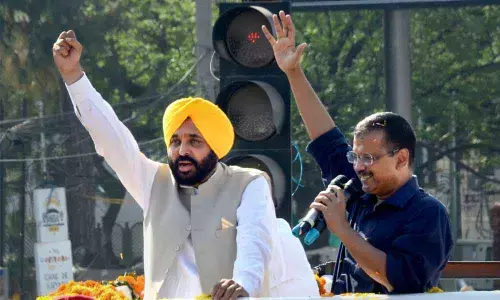 Delhi Chief Minister and AAP convenor Arvind Kejriwal and Punjab CM-elect Bhagwant Mann during a roadshow in  Amritsar on Sunday