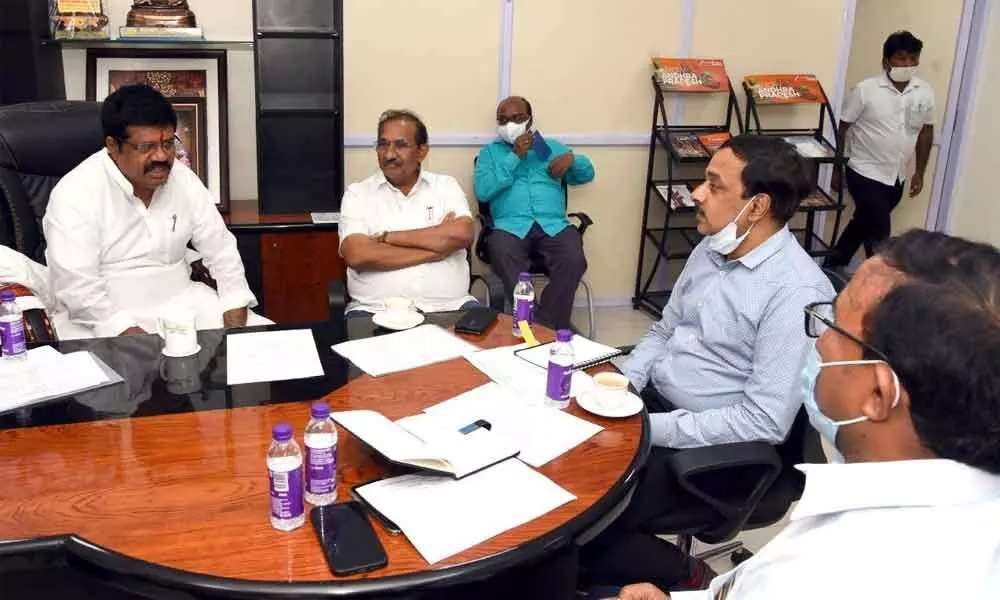 Tourism Minister M Srinivas Rao at a review meeting with the officials of tourism department in Vijayawada on Monday