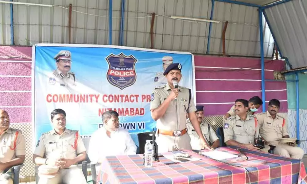 Nizamabad Deputy Commissioner of Police V Arvind Babu addressing the gathering during a Community Contact Programme held in Nizamabad on Monday