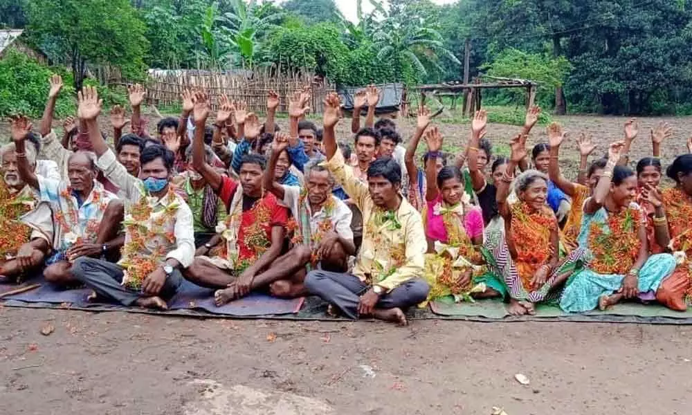 Tribals staging a protest at Rompalli panchayat in Visakhapatnam on Monday