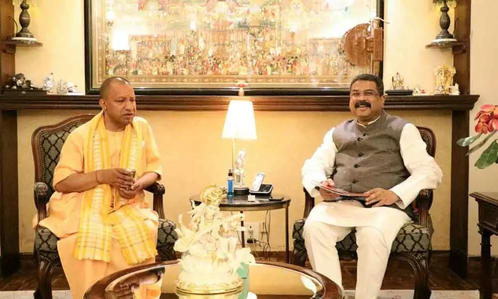 UP CM-designate Yogi Adityanath meets Union Minister Dharmendra Pradhan