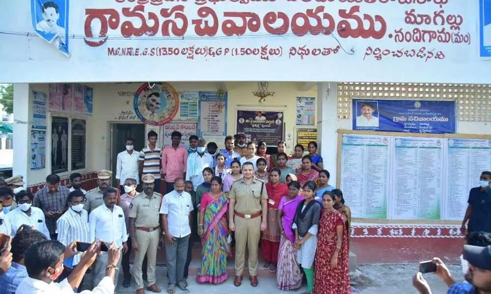 Krishna district Superintendent of Police Siddharth Kaushal alaong with the villagers of Magallu in Nandigama mandal on Tuesday