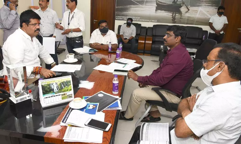 Sports Minister M Srinivasa Rao at a review meeting with the officials of Sports department at his office in Velagapudi on Tuesday
