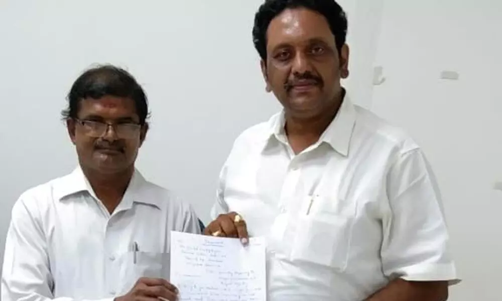 All India Panchayat Parishad national secretary  Dr Jasti Veeranjaneyulu submitting a memorandum to Tourism Additional Secretary Durga Prasad Sahu at his office in Velagapudi on Tuesday