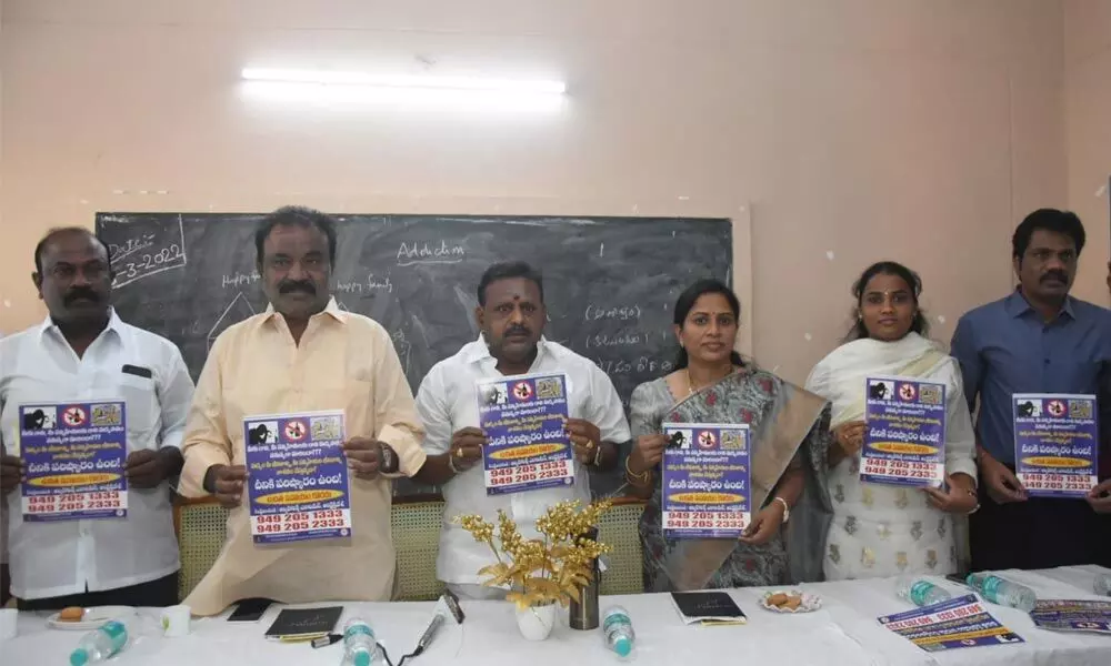 Mayor Dr R Sirisha along with corporators and officials releasing an awareness poster against vices at the Municipal Corporation- run de-addiction centre in Tirupati on Tuesday