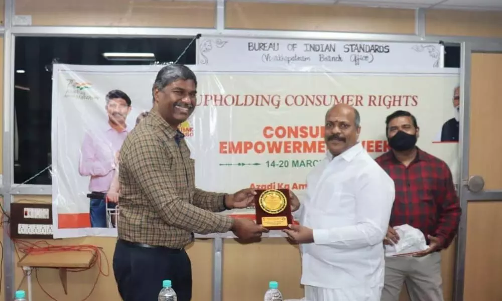 CMR Shopping Mall CMD Mavuri Venkata Ramana receiving a memento from BIS of Visakhapatnam region institute head MAJ Vinod in Visakhapatnam on Tuesday
