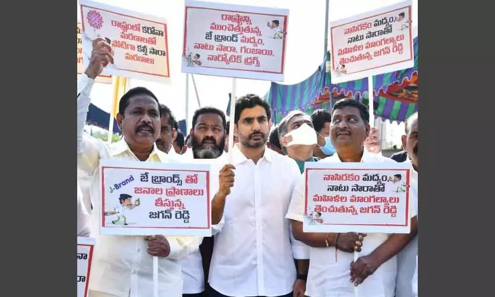 TDP legislators take out a rally demanding action against arrack, at Assembly on Thursday