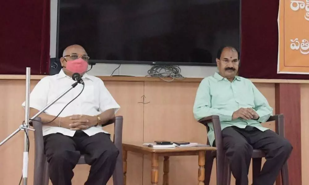 RSS Telangana general secretary Kacham Ramesh and vice president B Sunder Reddy addressing a press conference at RSS office Keshav Nilayam at Barkatpura on Thursday