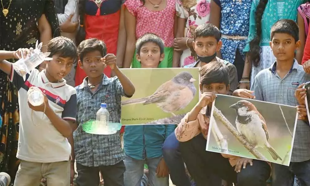 Students taking part in sparrow conservation programme in Visakhapatnam on Saturday