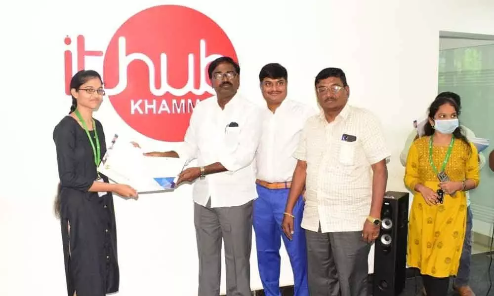 Minister for Transport Puvvada Ajay Kumar hading over an offer letter to a girl at IT Hub in Khammam on Saturday