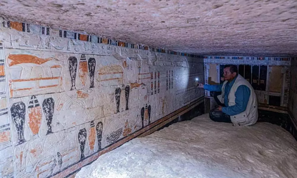 A limestone sarcophagus and colourful decorations were found in the tomb.