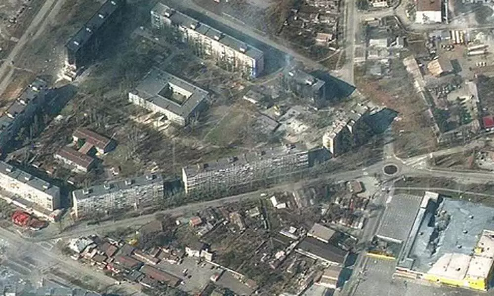 This satellite image provided by Maxar Technologies on Friday, March 18, 2022 shows damaged and burning apartment buildings and stores in Mariupol, Ukraine(Photo | AP)