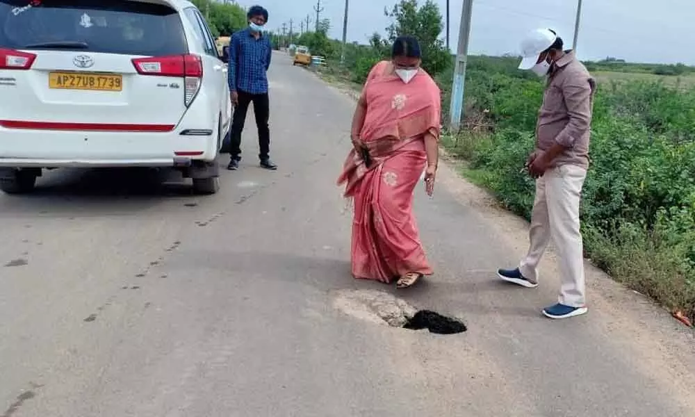 OMC Commissioner K Bhagyalakshmi inspecting the hole on Agraharam Road on July 20, 2021