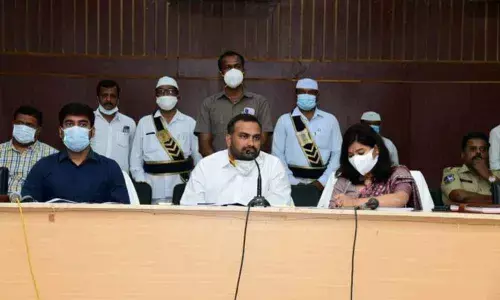 Collector RV Karnan speaking at a review meeting in Karimnagar on Monday