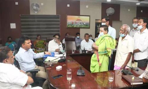 MCT Commissioner P S Girisha receiving complaints from the public during Spandana at the Municipal Office in Tirupati on Monday