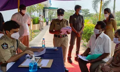 Urban SP Aishwarya Rastogi receiving petition from a petitioner during Spandana programme at SP office in Kakinada on Monday