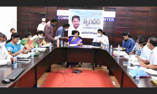 Mayor R Bhagyalakshmi, Commissioner Ranjit Basha, ACG Dr J Aruna and other officials attending Spandana at VMC office in Vijayawada on Monday