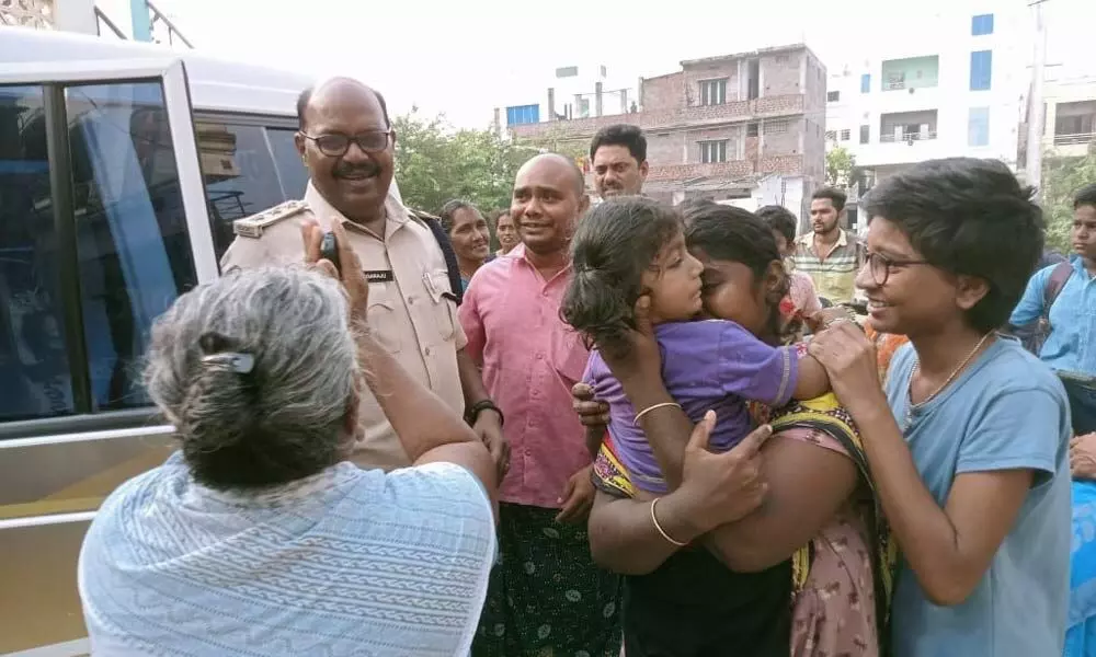 Ongole DSP U Nagaraju handing over the missing girl to her family members in Ongole on Tuesday